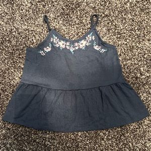 Children’s tank top with a flower design on the neckline. Brand: Art Class TM.